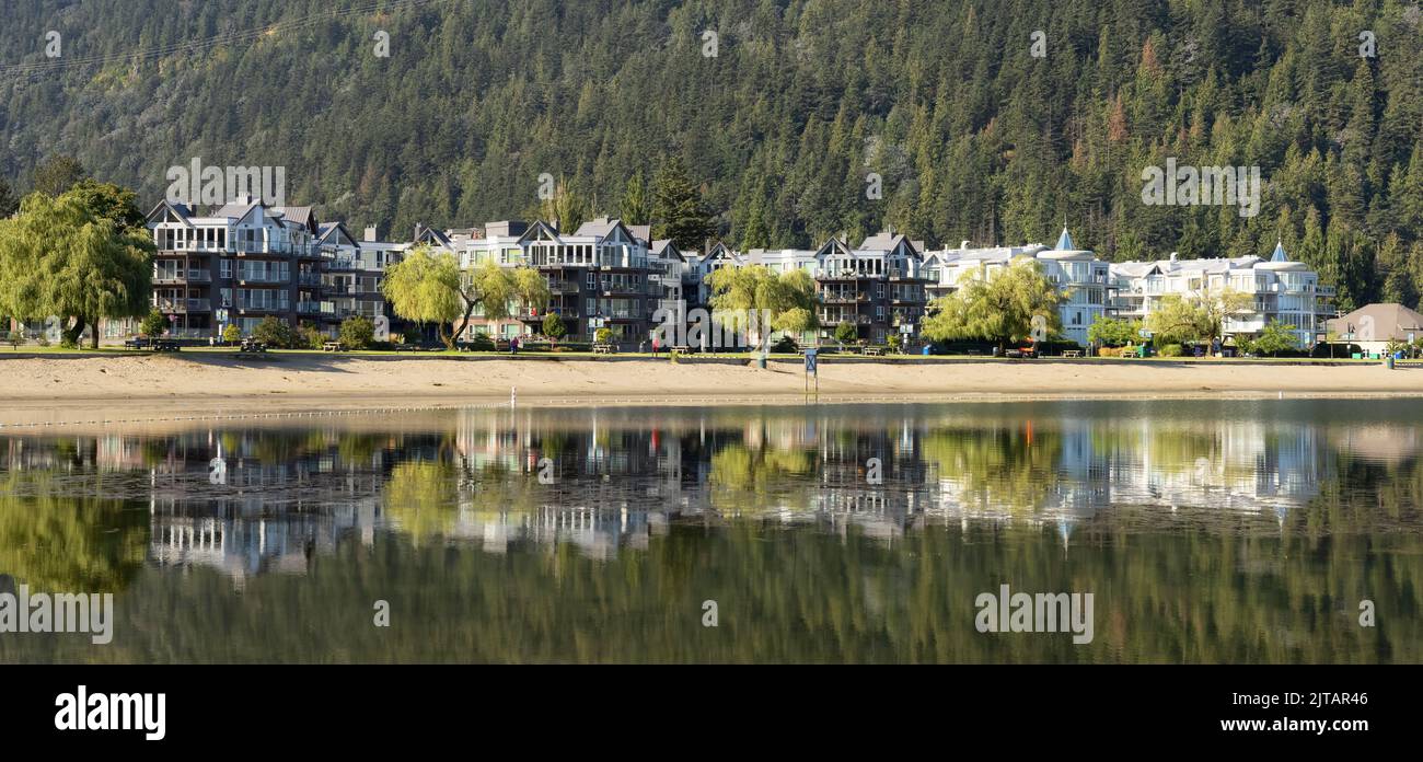 Vacation Homes by the lake and sandy beach. Sunny Summer Morning Stock