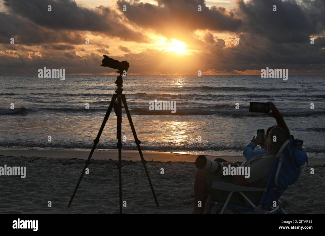 Cocoa Beach, United States. 29th Aug, 2022. Photographers wait on the