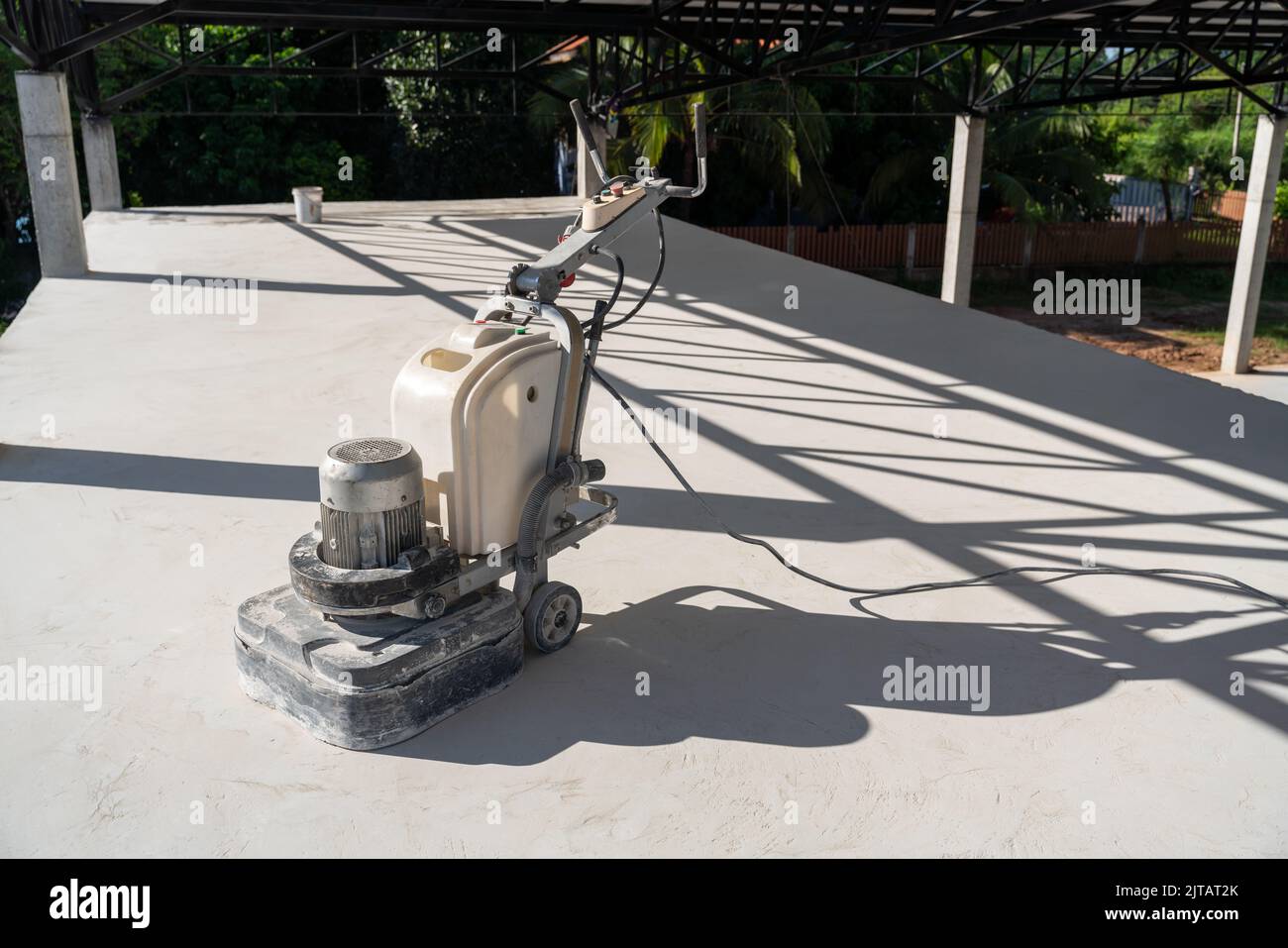 Concrete surface sanding machine at construction site. Concrete floors