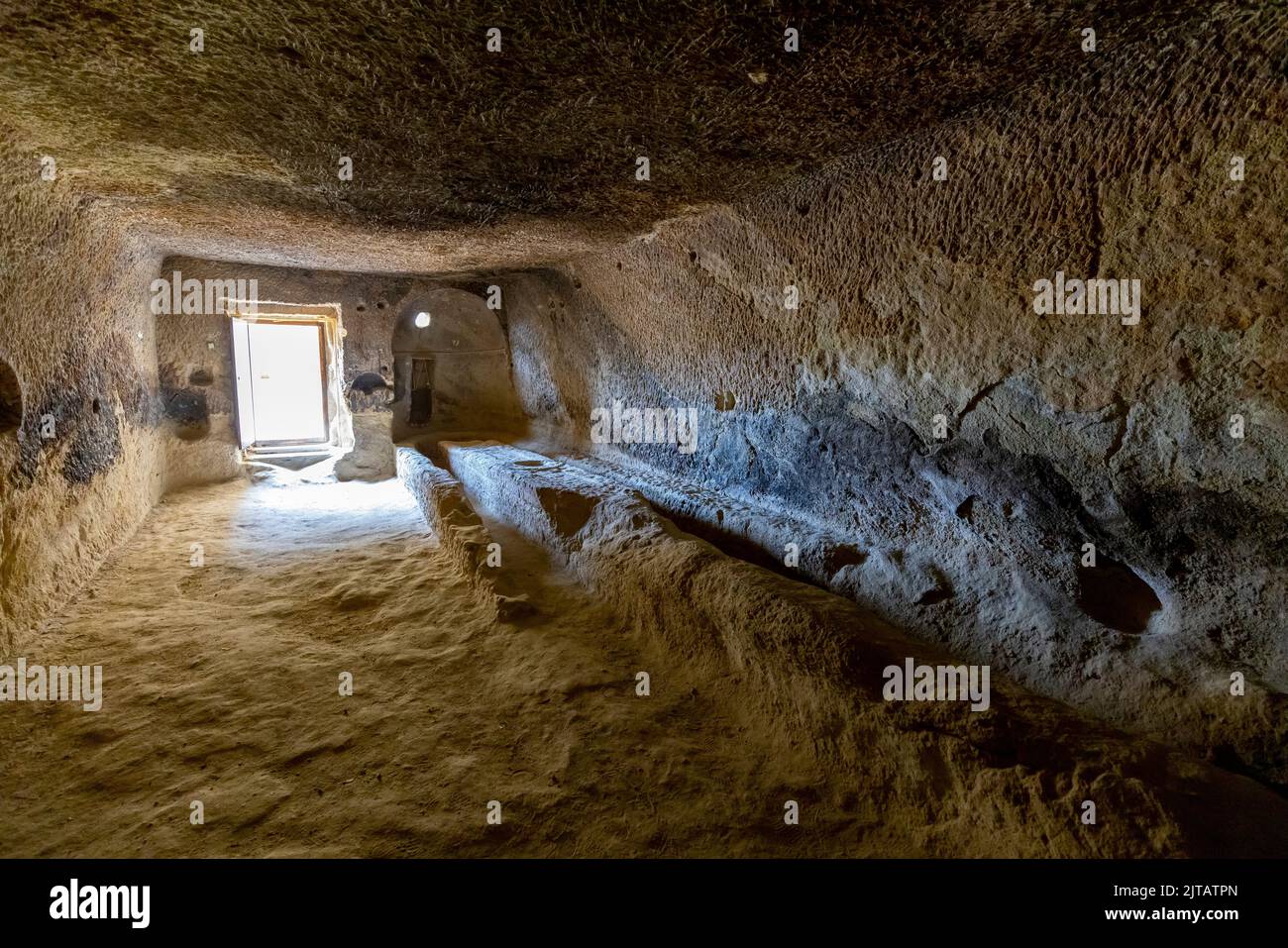 open air museum in goreme turkey, detail of an interior room carved into the tuff. Stock Photo