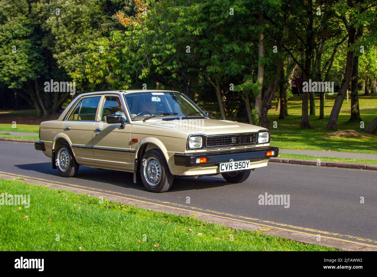 1983 80s eighties Beige TRIUMPH ACCLAIM 1335cc Petrol; Cars arriving at the annual Stanley Park Classic Car Show in the park gardens. Stanley Park classics yesteryear Motor Show Hosted By Blackpool Vintage Vehicle Preservation Group, UK. Stock Photo