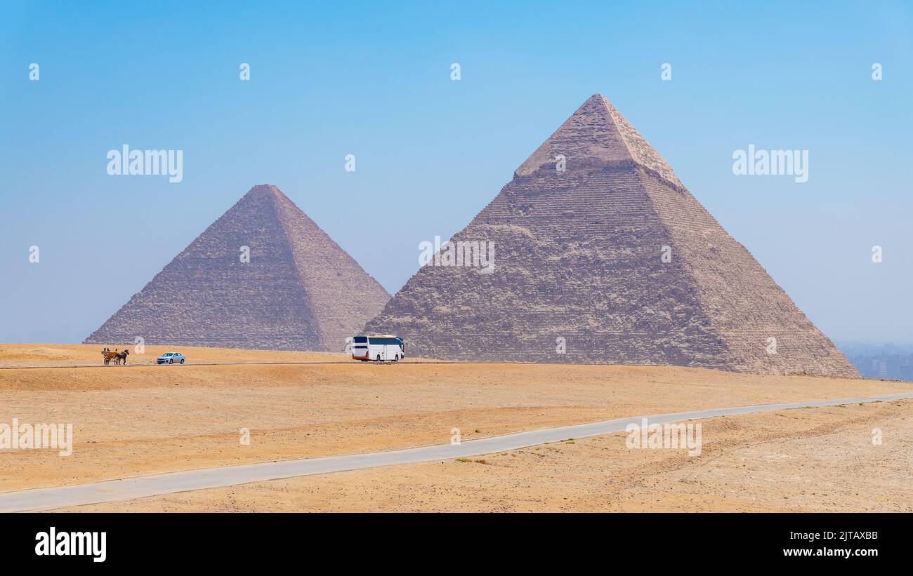 Modern forms of transport at the pyramids of Giza, Egypt Stock Photo