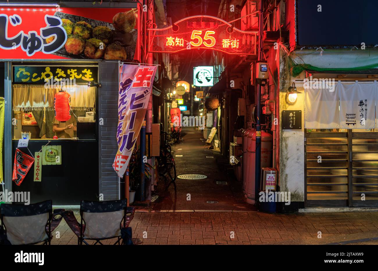 Kochi, Japan August 10, 2022 Empty entrance to quiet back alley filled with restaurants at