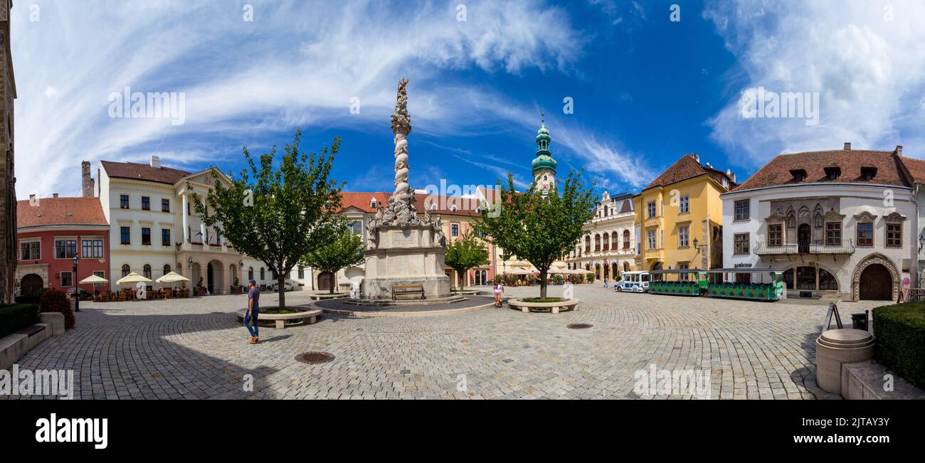 Fo ter (Main Square) with Holy Trinity Statue (1701), Firewatch Tower and tourist train, Sopron, Hungary Stock Photo