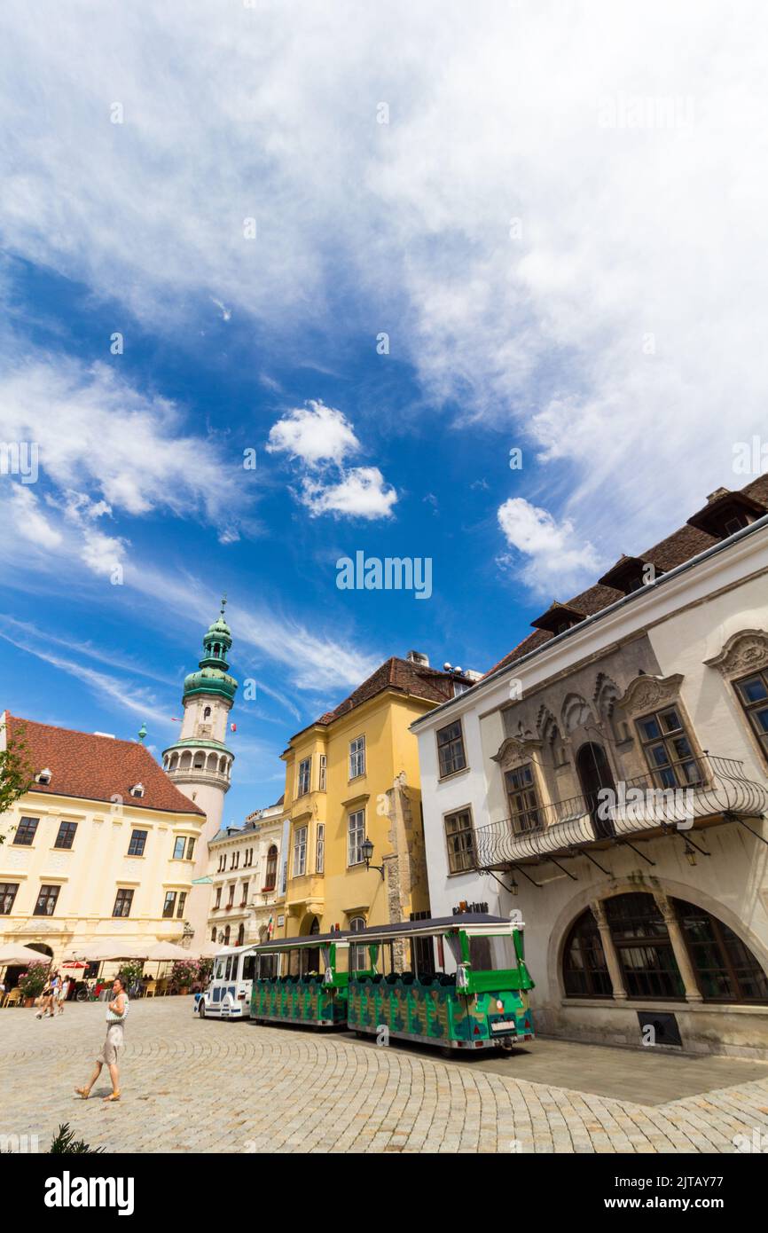 Fo ter (Main Square) with Firewatch Tower and tourist train, Sopron, Hungary Stock Photo