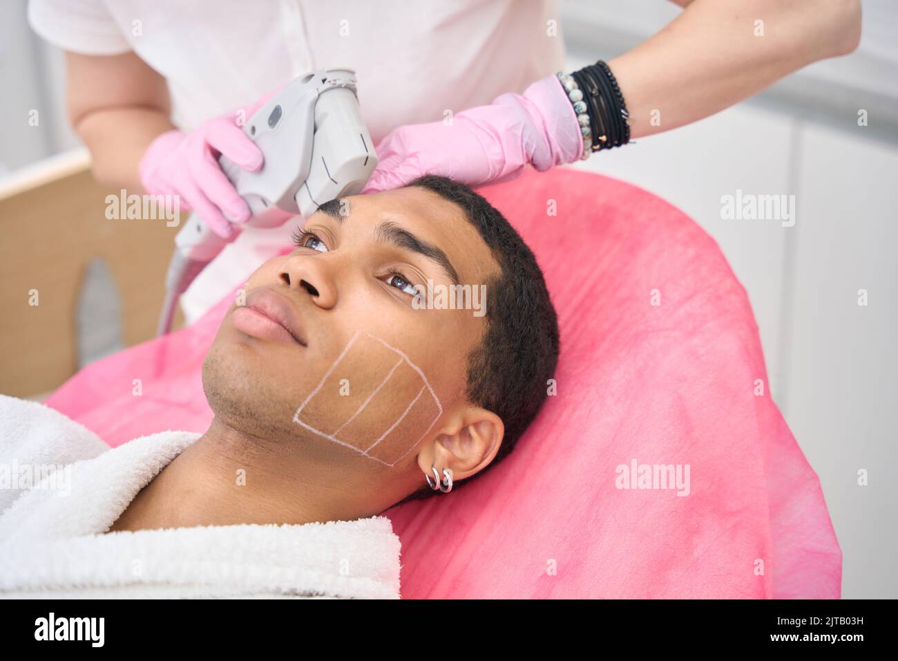 Man getting ultrasound skin tightening in beauty clinic Stock Photo - Alamy