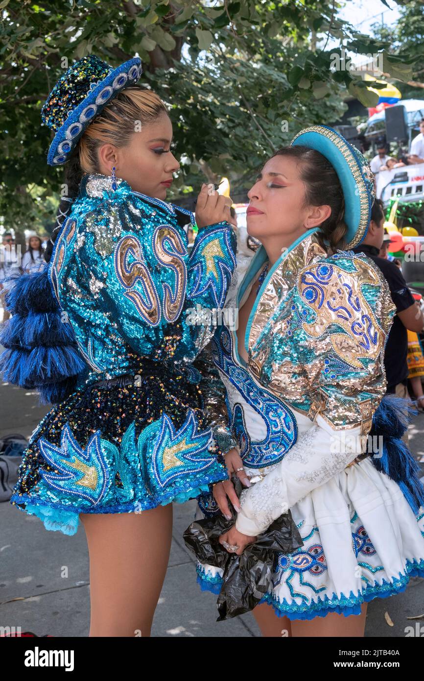 Women dancers from the Caporales San Simon Sucre prepare for the Ecuadorian Parade NYC 2022. In Jackson Heights, Queens, New York City. Stock Photo
