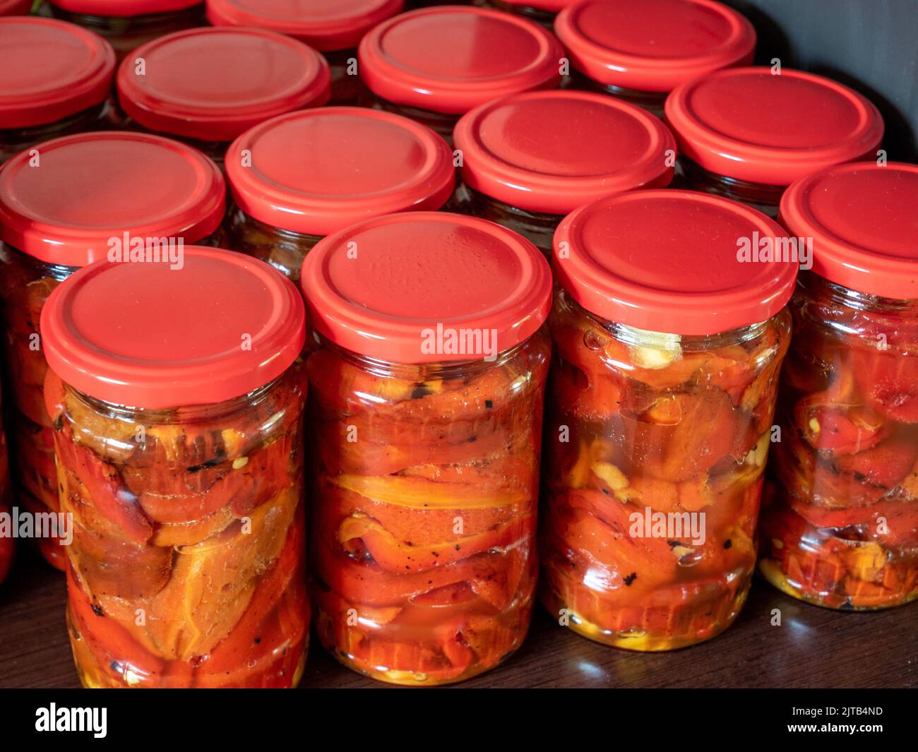 jars with preserved peppers Stock Photo