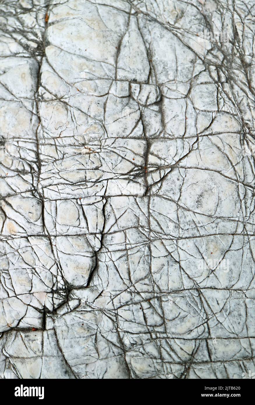 Texture of Weathered Stone Surface for Background or Wallpaper Stock