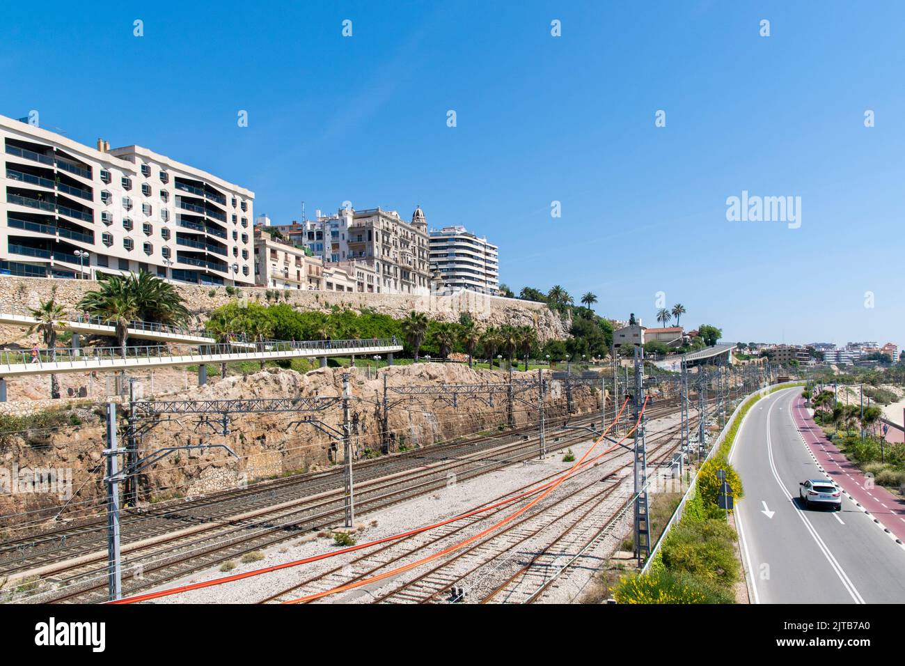 Train line and car highway close to El Miracle beach at Tarragona, Spain Stock Photo