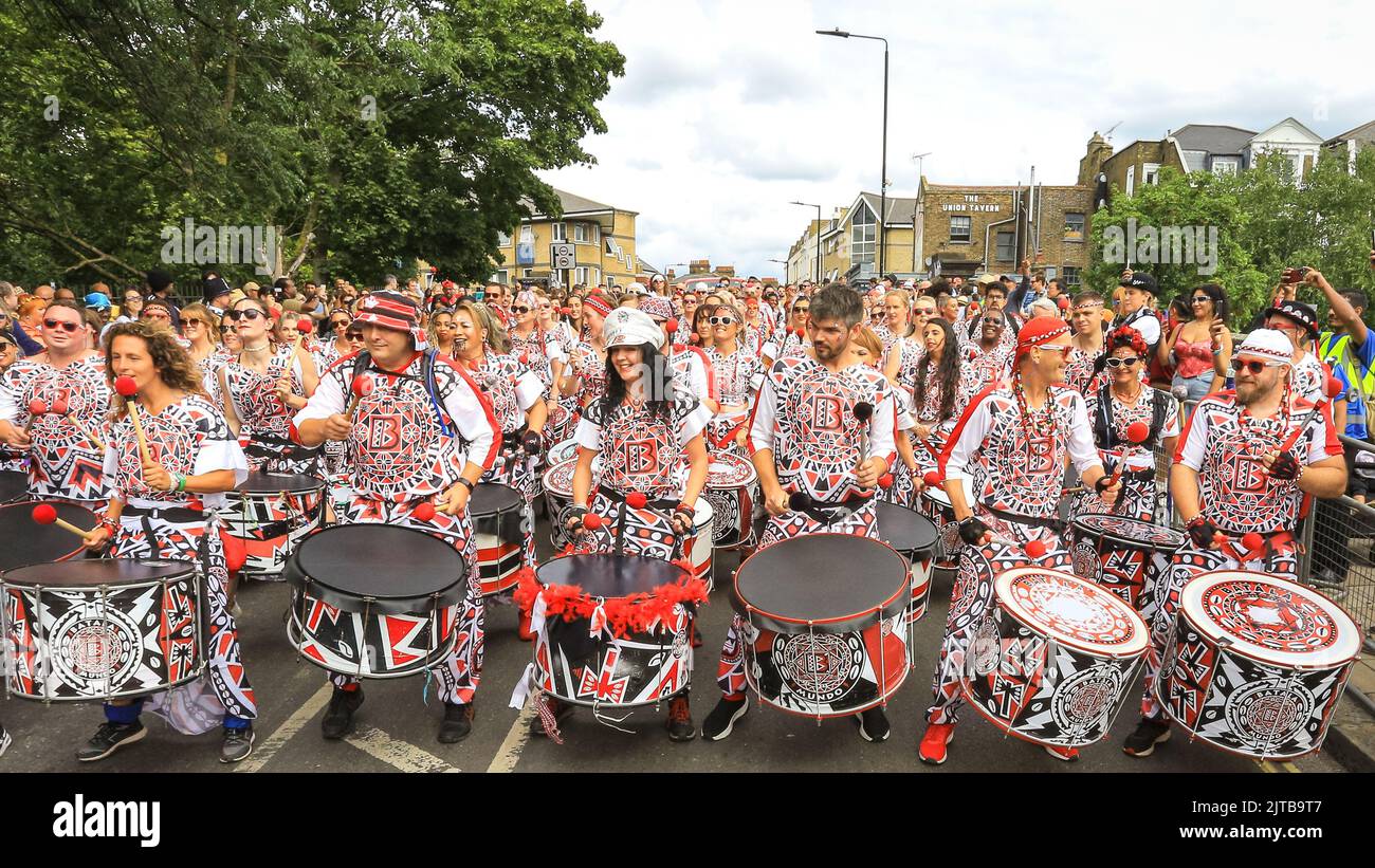 London, UK. 29th Aug, 2022. The start of the parade with the eagerly awaited first steel drum band, the Batala Portsmouth. Participants and revellers have fun along the main parade at Notting Hill Carnival 2022. The carnival, a celebration of Caribbean culture, returns to London after 2 years of restrictions and is expected to easily exceed 1 million visitors again this year. Credit: Imageplotter/Alamy Live News Stock Photo