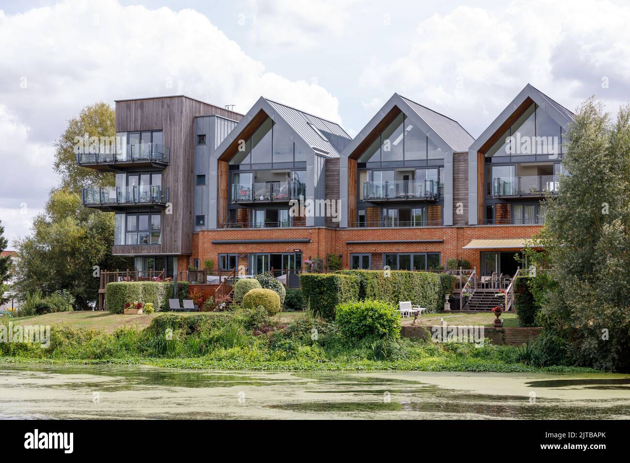 Modern riverfront apartments The Stadbury with communal gardens leading