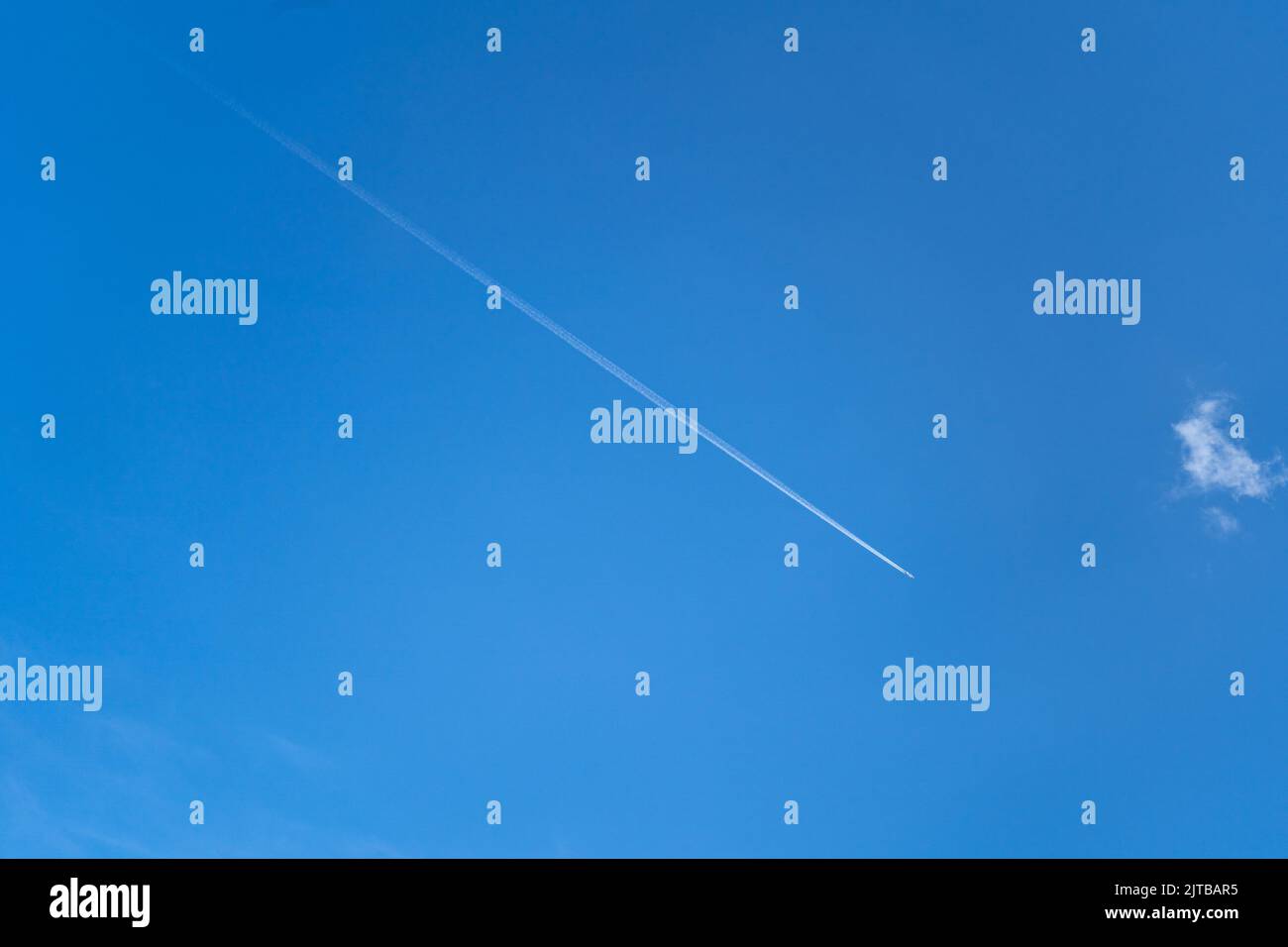 A view of a plane on a blue sky background Stock Photo - Alamy