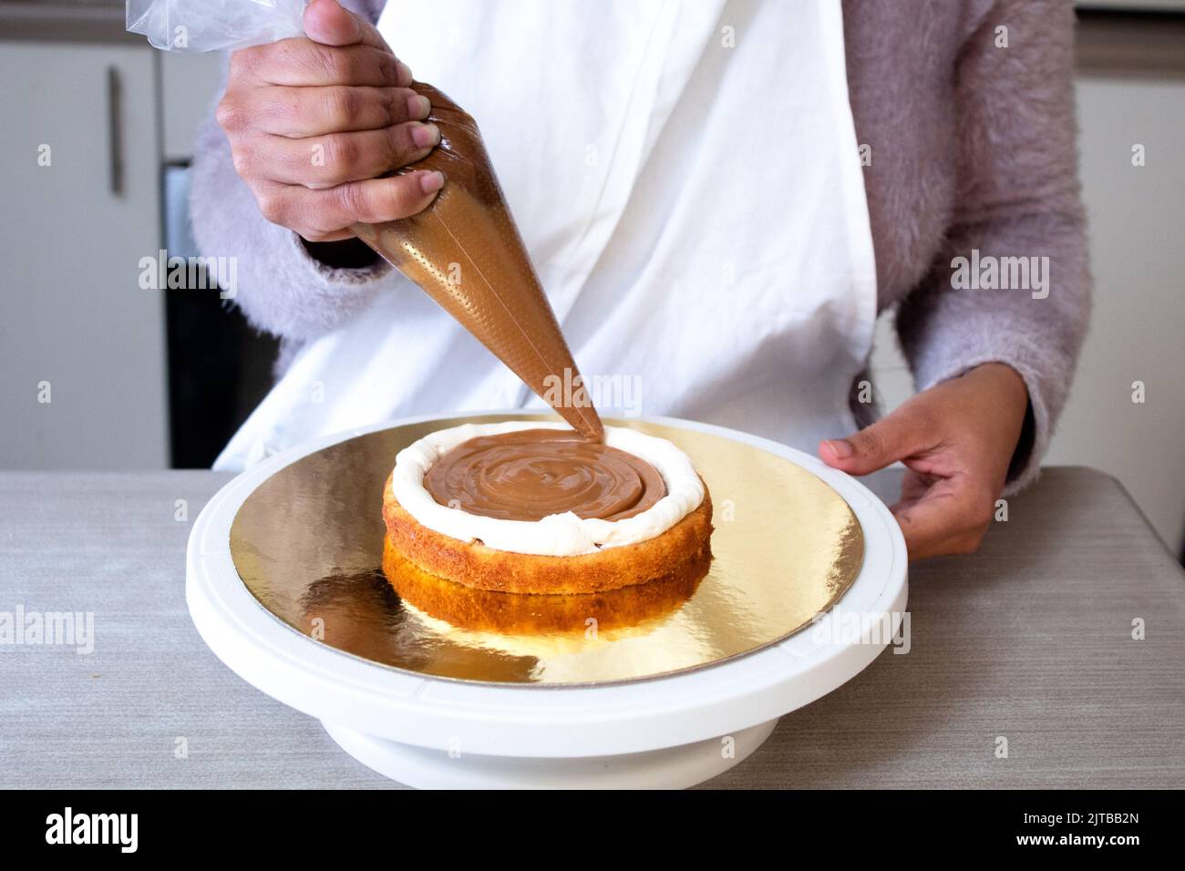 Chef making a cake Stock Photo Alamy