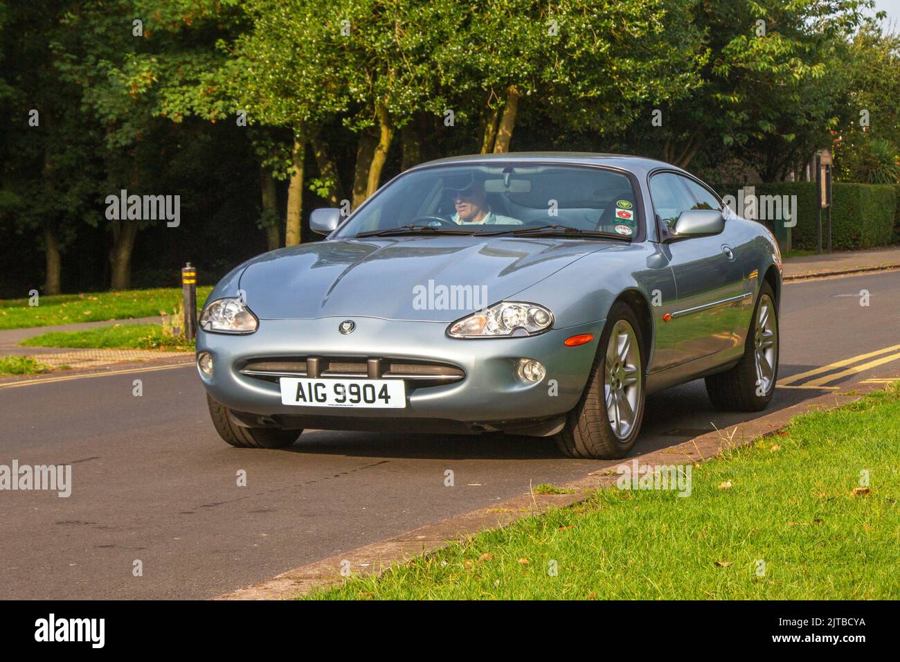Silver petrol jaguar xk8 coupe cars hi-res stock photography