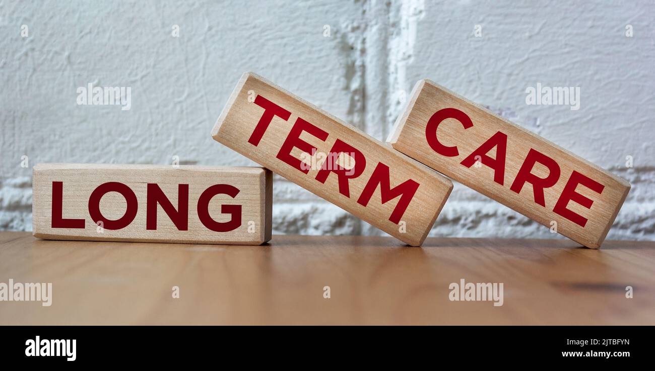 Word LONG TERM CARE on wooden blocks and beautiful background Stock Photo