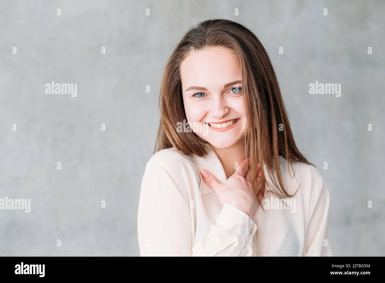 young woman portrait shy compliment copy space Stock Photo
