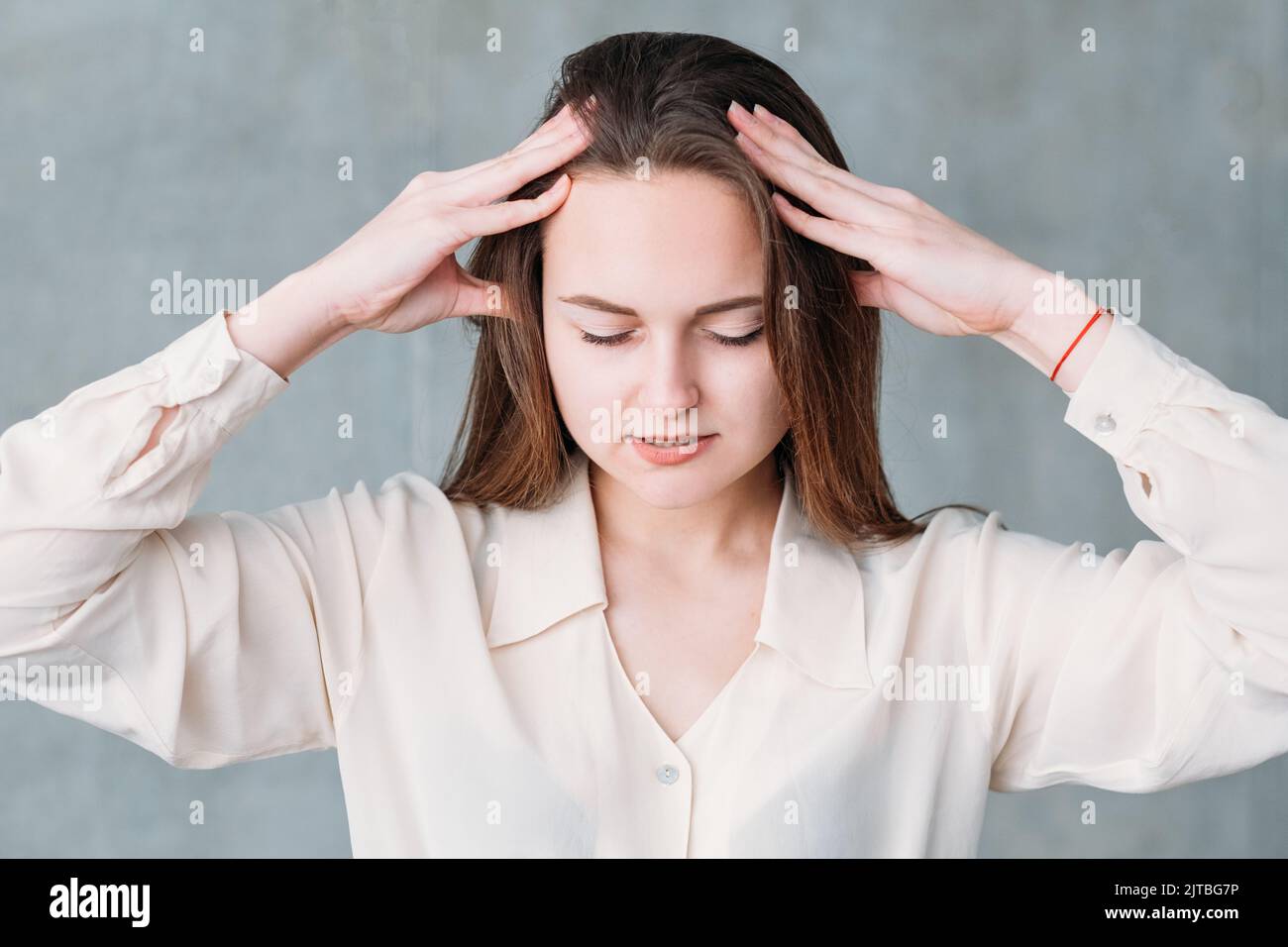 distressedssed woman head massage gentle pressure Stock Photo