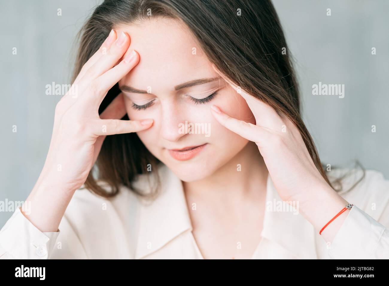 concerned business woman concentration closed eyes Stock Photo