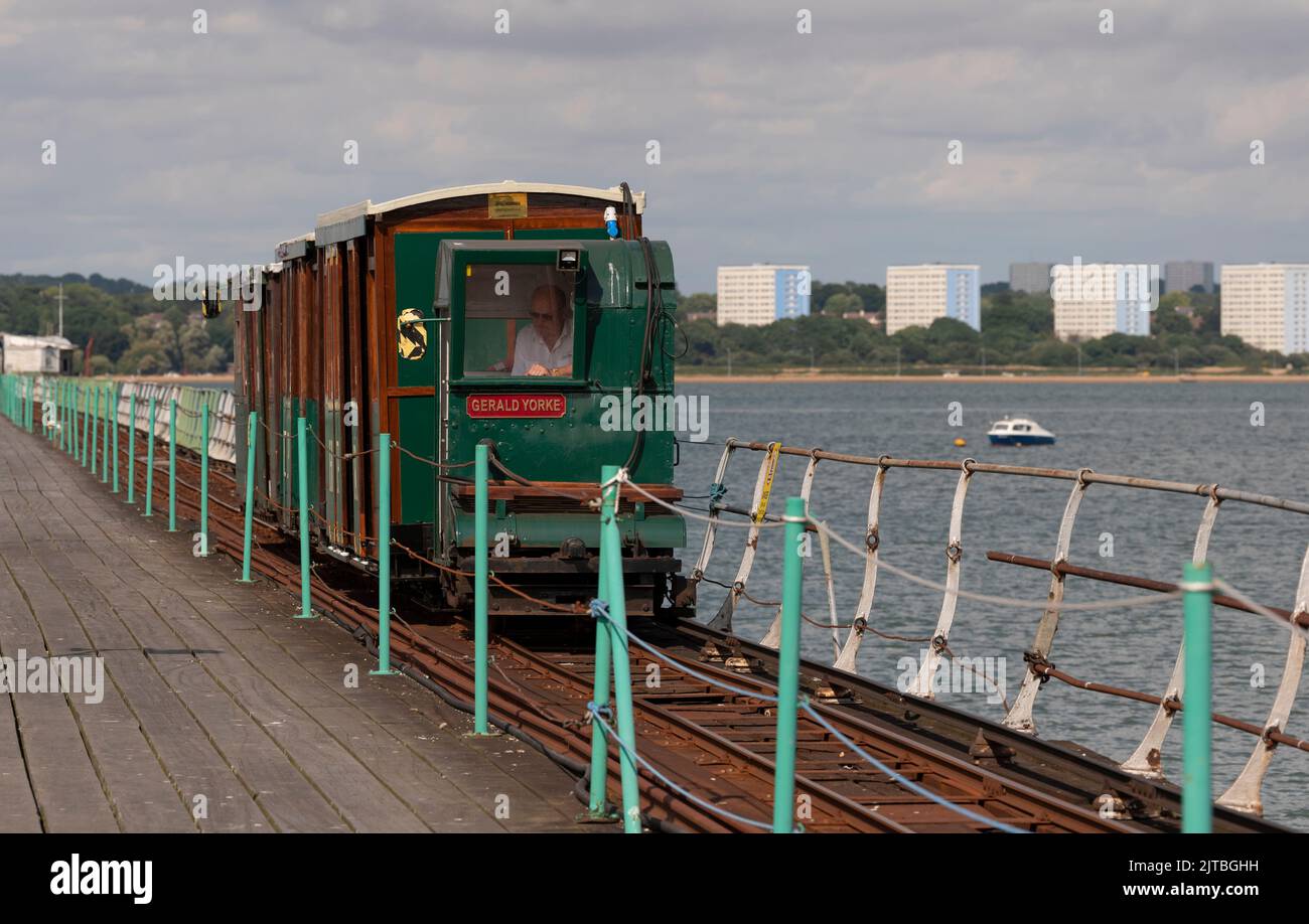 Southampton Water, southern England, UK. 2022. Tractor unit Gerald Yorke and passenger coaches on Hythe Pier on Southampton Water. The train transport Stock Photo