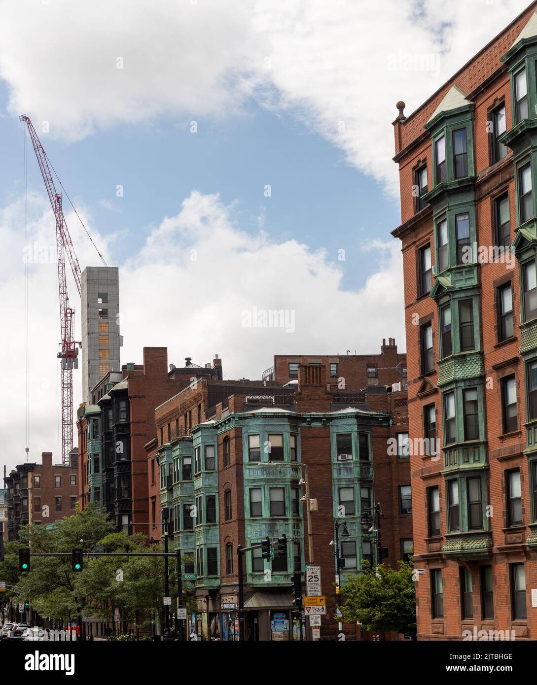 A few old buildings in Boston with new construction and crane Stock