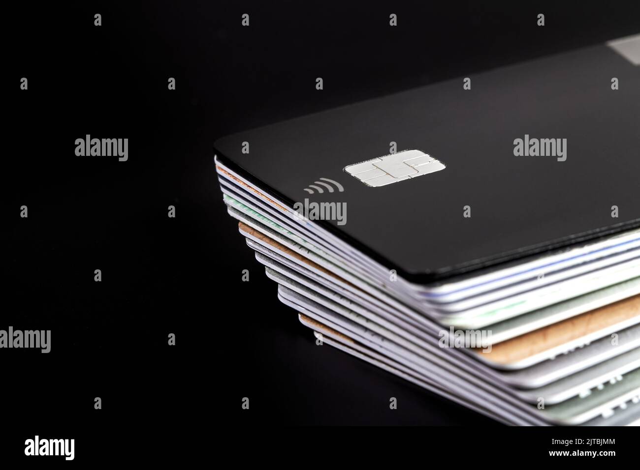 A stack of bank credit cards on dark background Stock Photo - Alamy