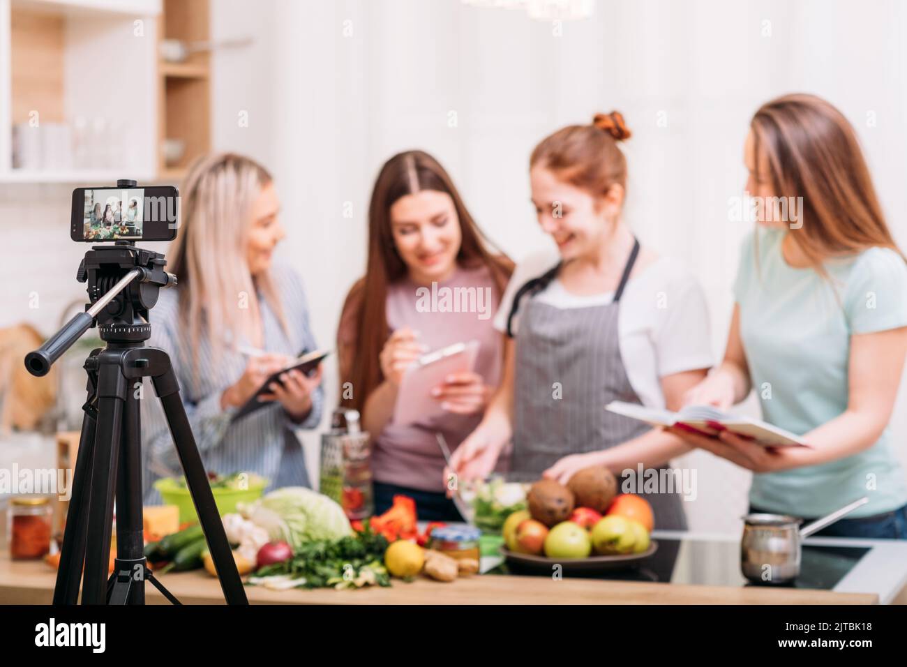 cooking class food blog video tutorial phone women Stock Photo