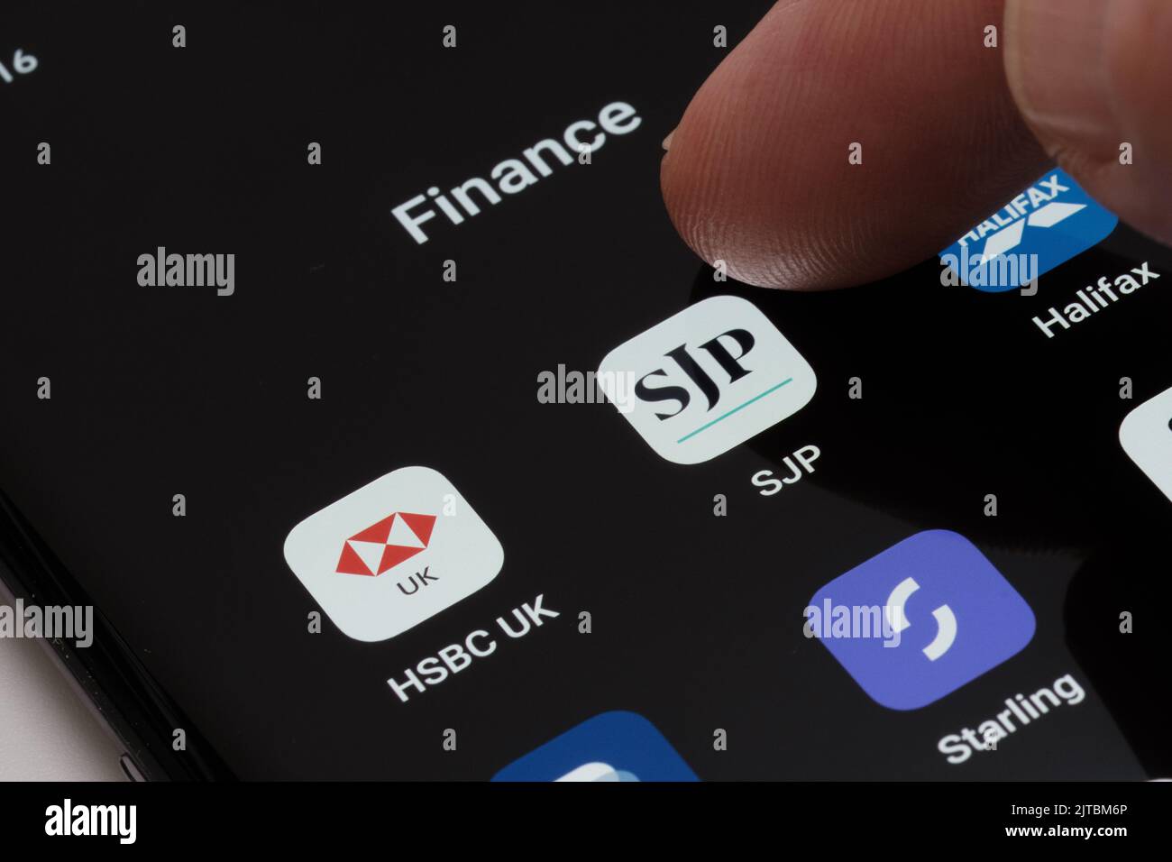 SJP app seen on smartphone screen between other finance apps as HSBC UK, Halifax. St. James's Place (SJP) is an Expert Financial Advice company. Staff Stock Photo