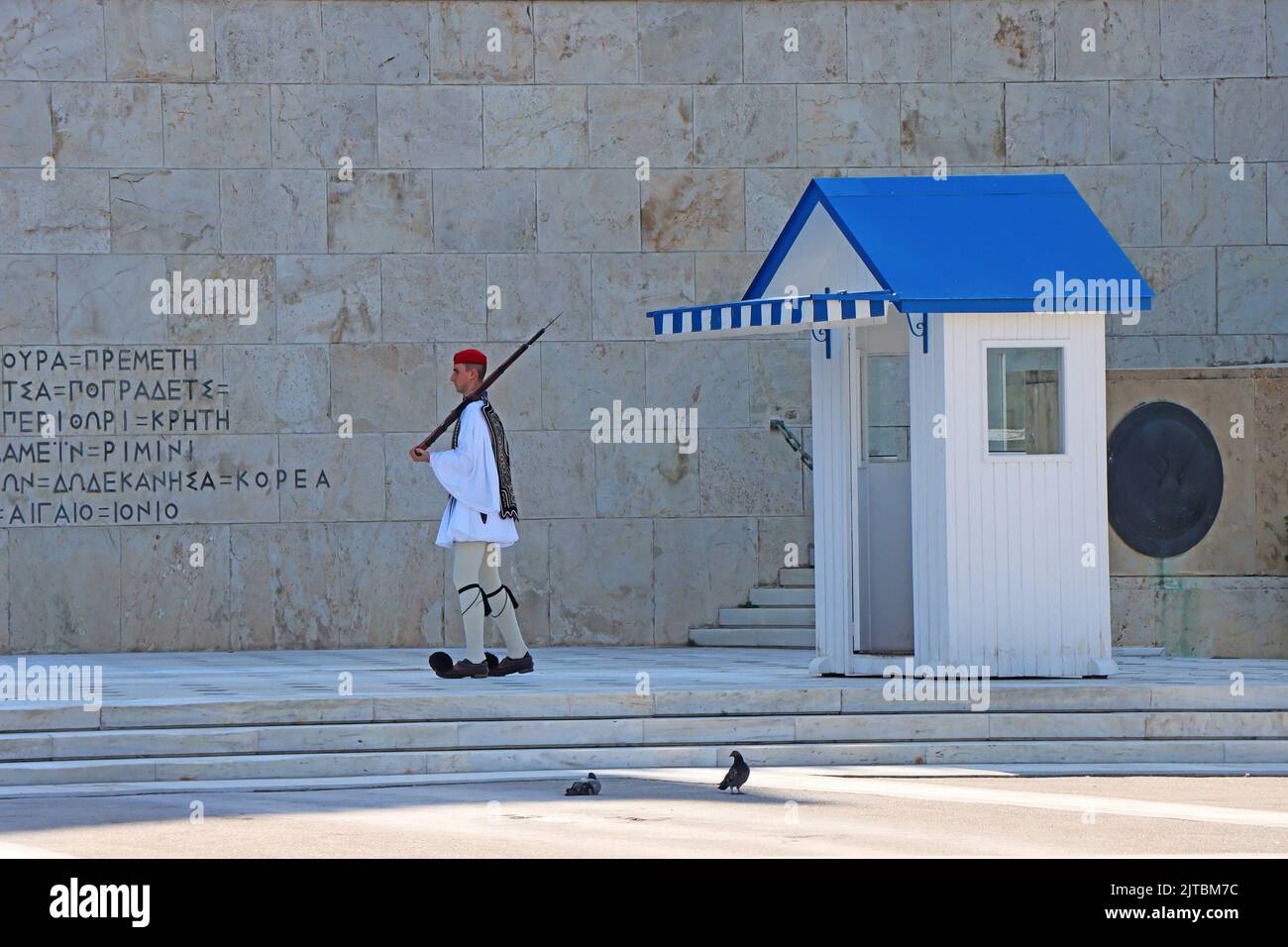 Athens, Greek - August 28: 2022: Change of Guard at the in front of the parliament, Monument of the Unknown Soldier at Syntagma Square the central squ Stock Photo