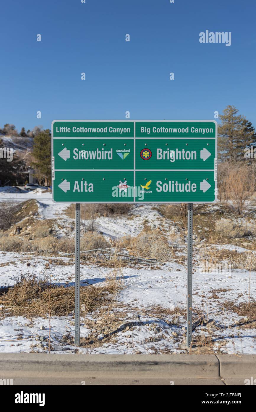 Huge road sign in mountains showing the directions to little