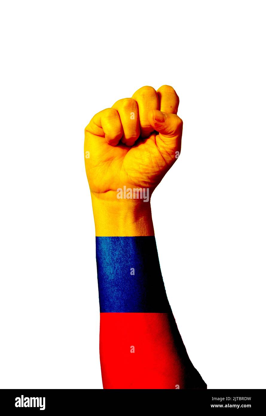 Flag of Colombia painted on human fist. Strength, power, concept of conflict. Raised fist. Stock Photo