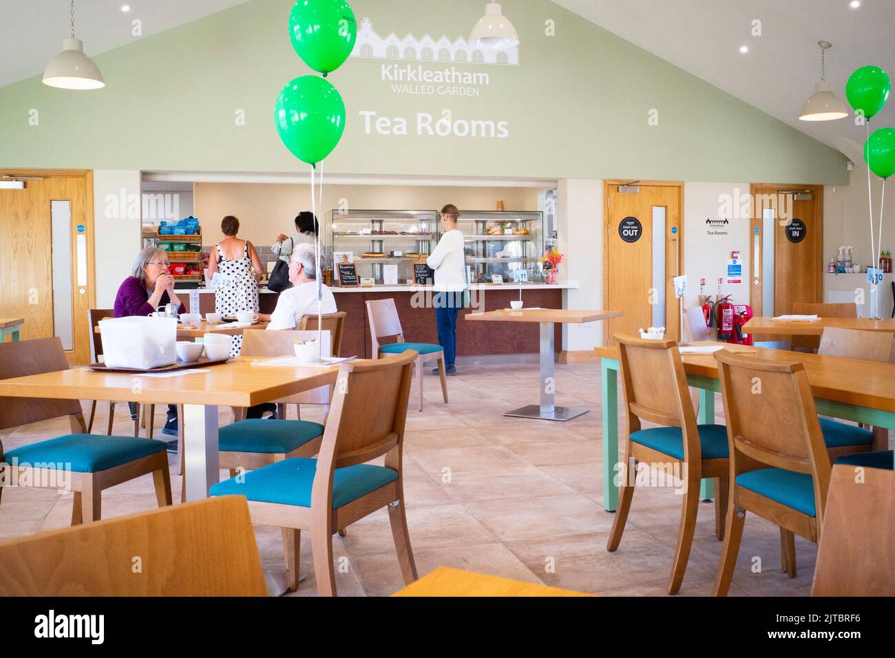 Kirkleatham tea room with green ballons celebrating 1st anniversary of first opening Stock Photo