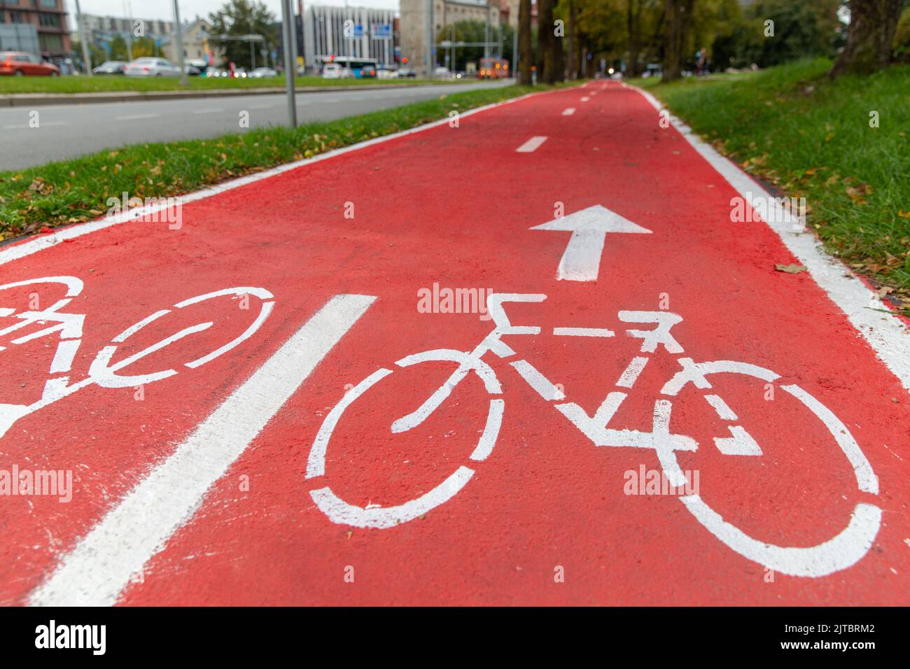 bike lane or red road with signs of bicycles Stock Photo Alamy