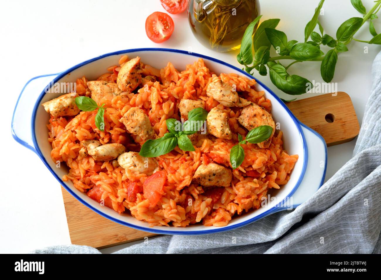 Kritharaki with tomatoes and chicken. Traditional type of Greek pasta
