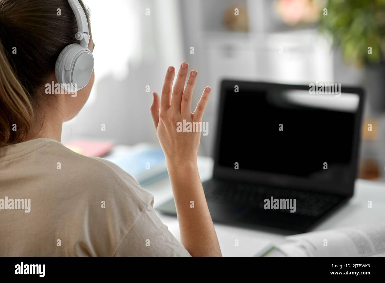 student with laptop having video call at home Stock Photo - Alamy