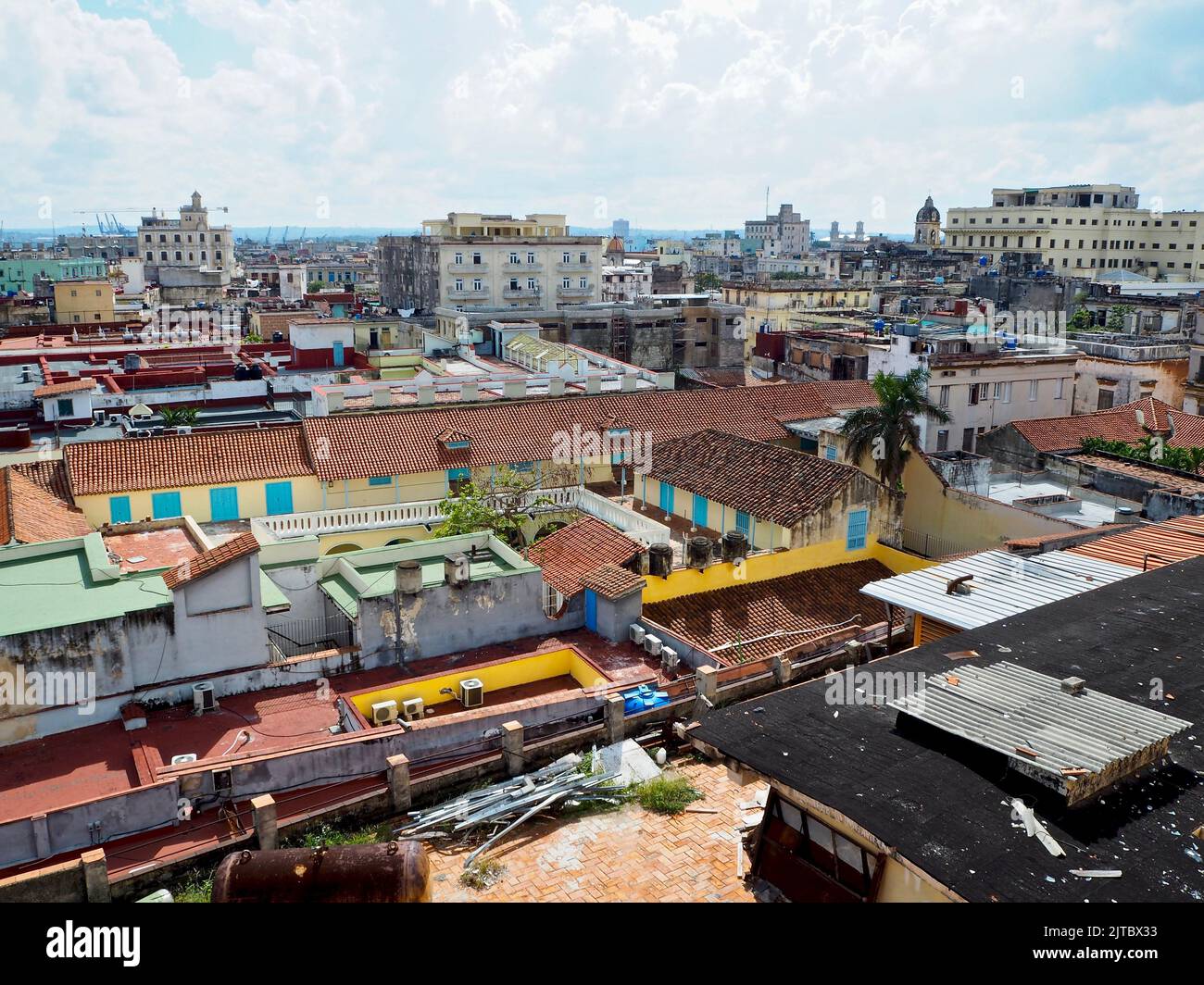 A cityscape with colorful rooftops of Havana, Cuba, with beautiful clouds in the background Stock Photo