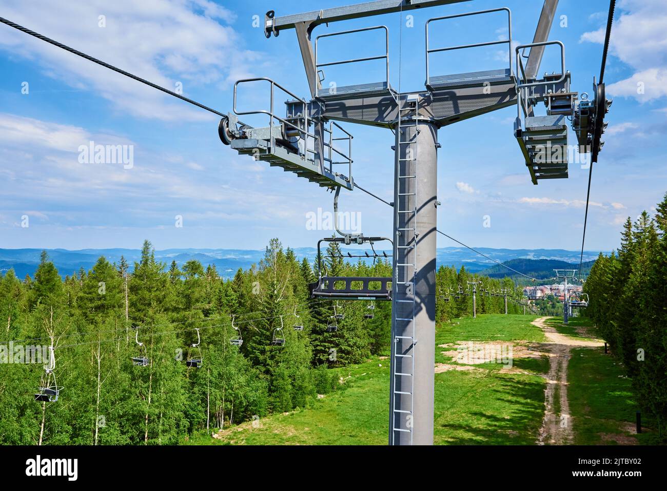 Open cable car line. Metal cable and moving rollers on platform for funicular mechanism, close up. Karpacz resort in Poland with lift road Stock Photo