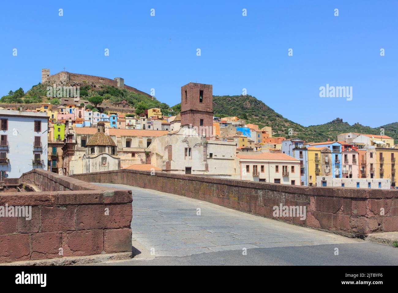 View from the Old Bridge at the campanile of Bosa cathedral and the 12th-century Castle of Serravalle in Bosa on the island of Sardinia, Italy Stock Photo