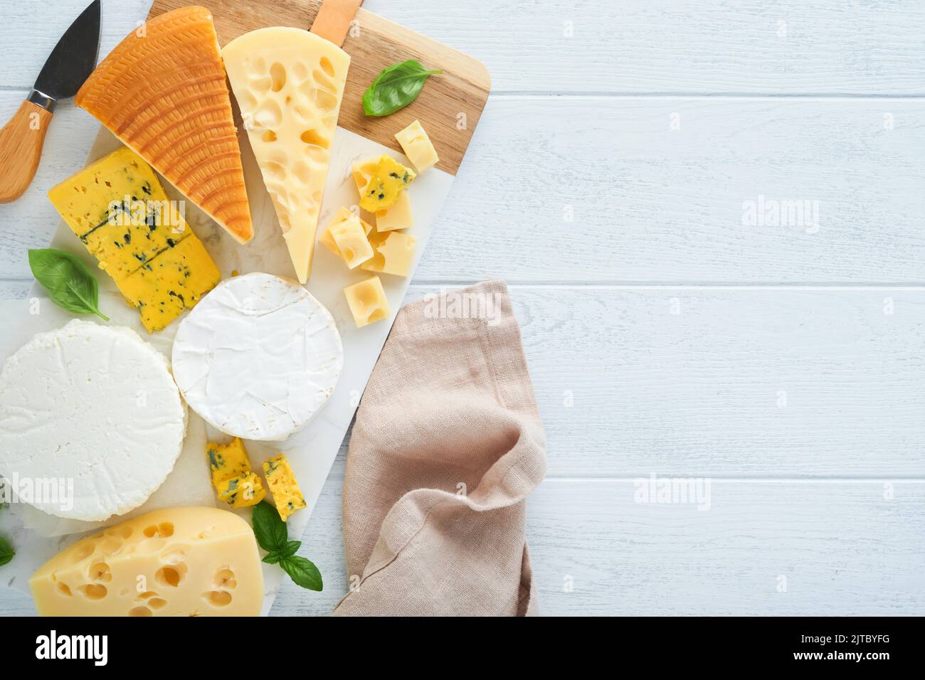 Set or assortment cheeses. Maasdam, smoked cheese, camembert, blue