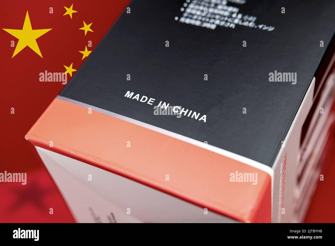 Product carton, black red with "Made In China" imprint. Background red