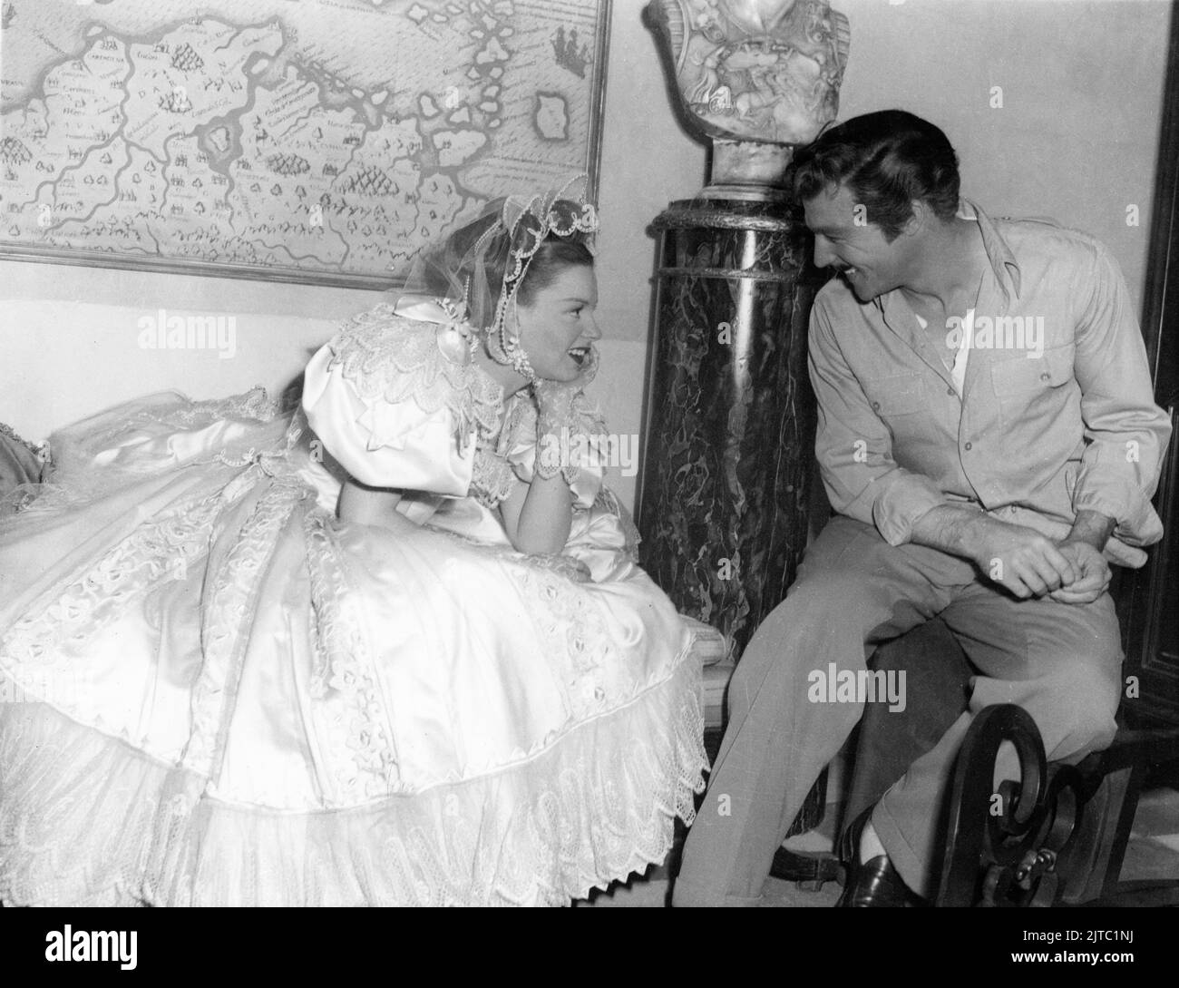JUDY GARLAND and GENE KELLY on set candid during filming of THE PIRATE 1948 director VINCENTE MINNELLI play S.N. Behrman songs by Cole Porter costume design Tom Keogh producer Arthur Freed Metro Goldwyn Mayer Stock Photo