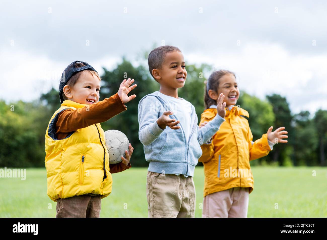 happy children with soccer ball at park Stock Photo - Alamy