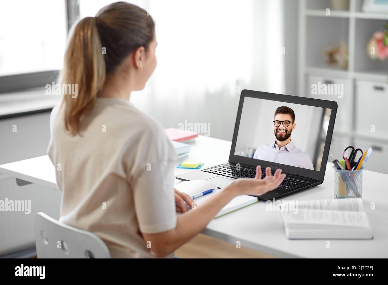 student woman with laptop has video call with man Stock Photo - Alamy