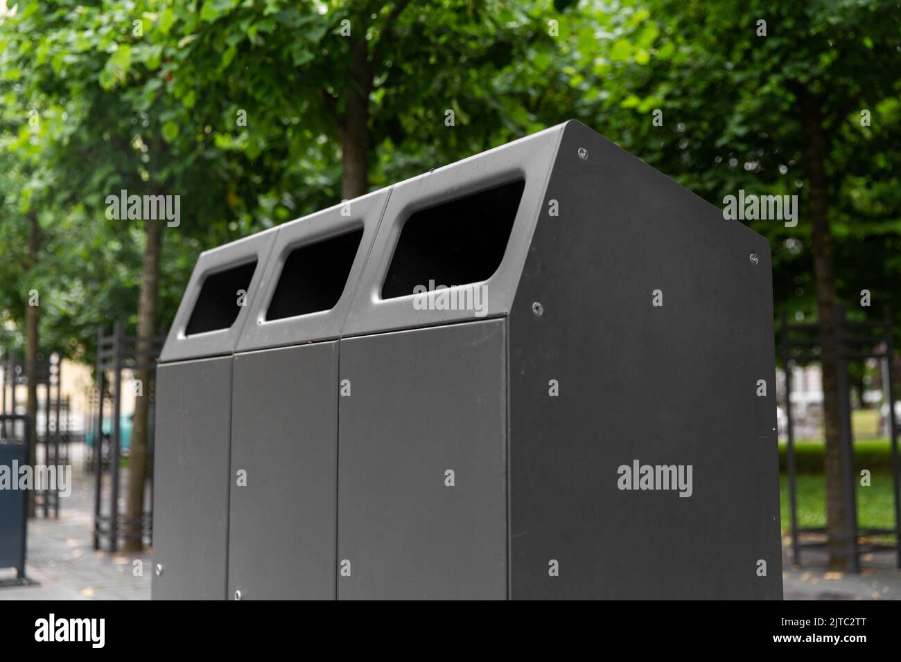 trash container on city street Stock Photo Alamy