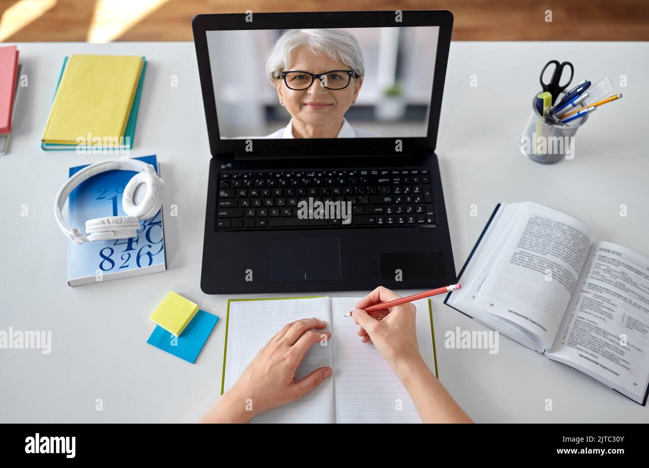 hands of student with teacher on laptop screen Stock Photo - Alamy