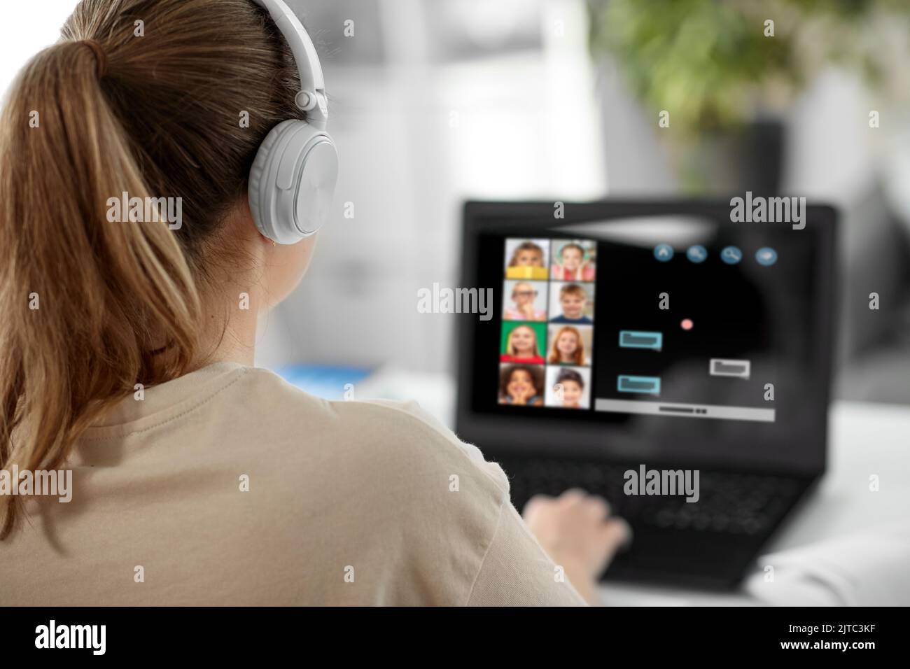 female teacher with laptop having online class Stock Photo - Alamy