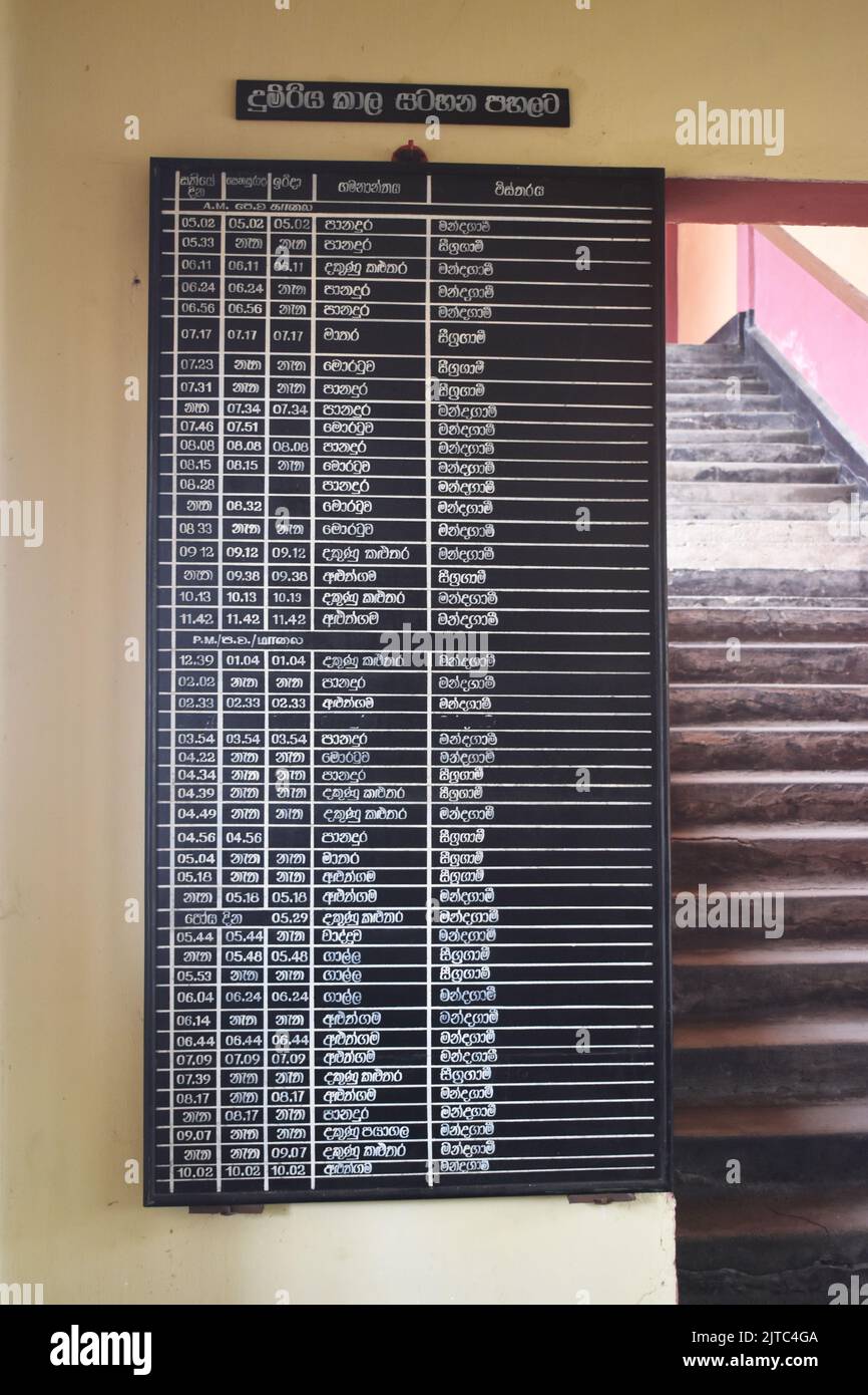 Train shedule at a railway station in Colombo. The Railway Network was introduced by the British in 1864 and 1st train ran on 27th December 1864, with the construction of the Main Line from Colombo to Ambepussa, 54 kilometers to the east. The Sri Lankan rail network is 1,508 km (937 mi) of 5 ft 6 in (1,676 mm) broad gauge. Some of its routes are scenic, with the main line passing (or crossing) waterfalls, mountains, tea estates, pine forests, bridges and peak stations. Sri Lanka. Stock Photo