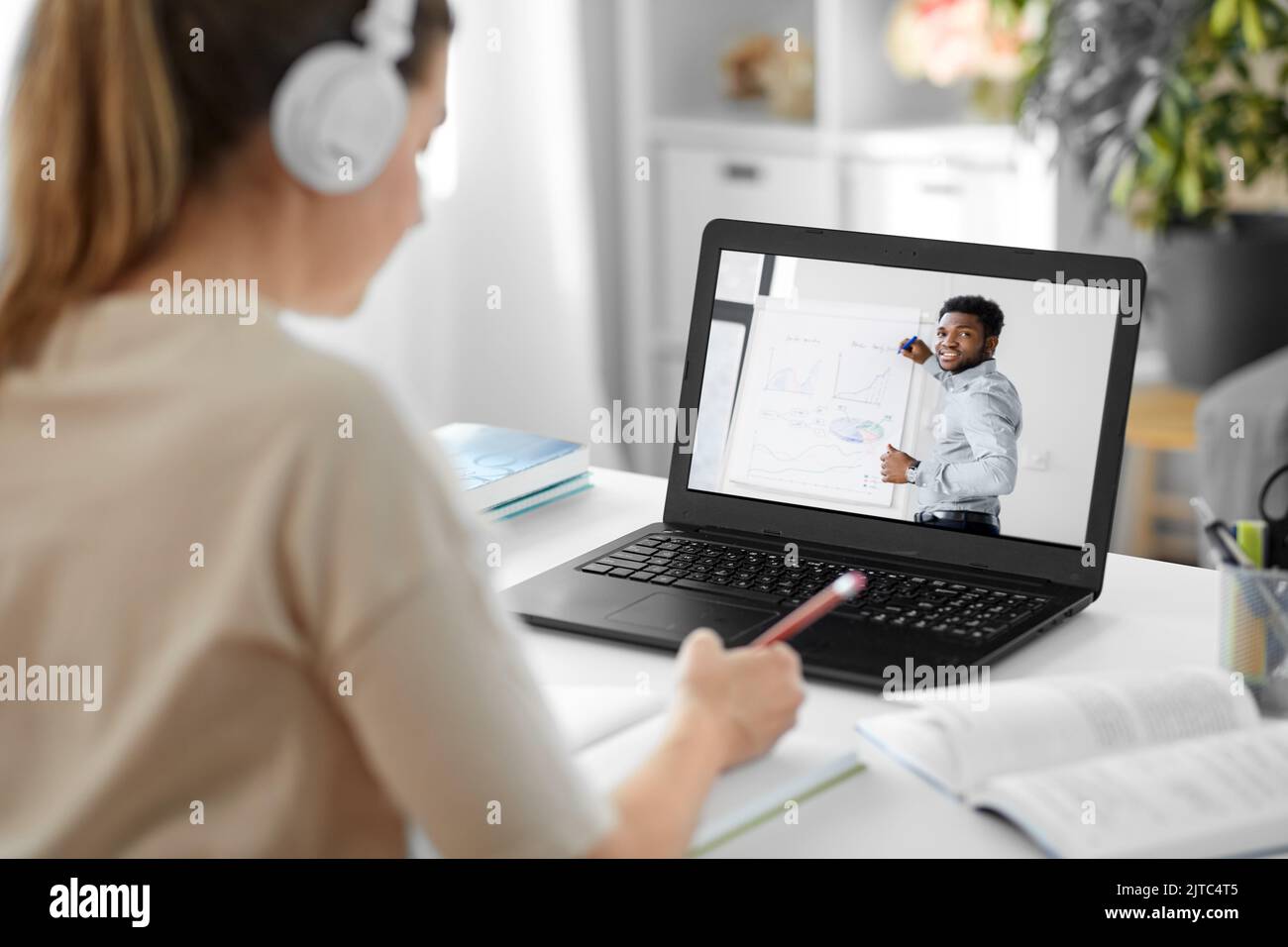 student with laptop having video call with teacher Stock Photo - Alamy