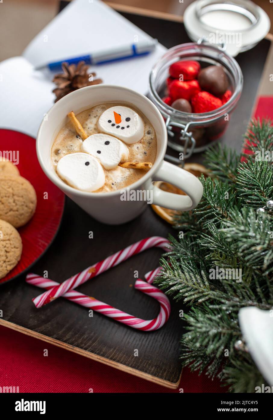 marshmallow snowman in cup of coffee on christmas Stock Photo