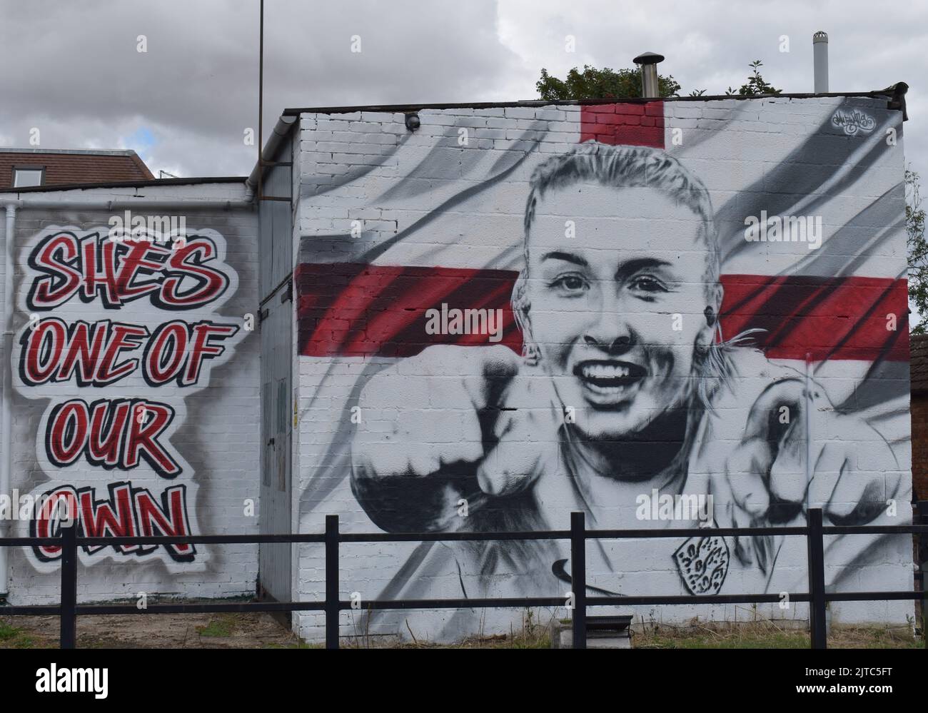 The mural of Leah Williamson in her hometown of Newport Pagnell. It shows Leah with an England flag and the words: 'She's one of our own'. Stock Photo